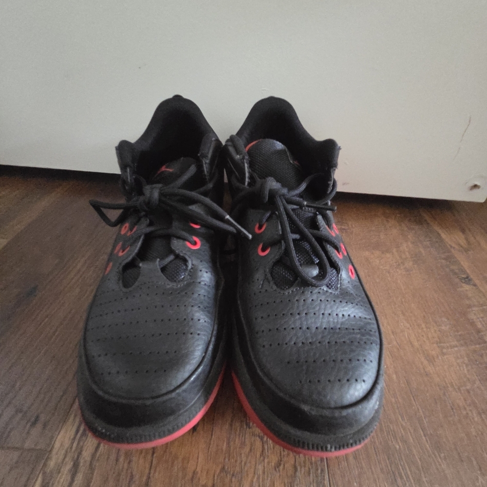 Youth Jordan Black and red Sneakers.